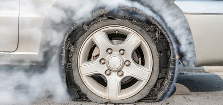 What to do if a tyre suddenly bursts while driving?